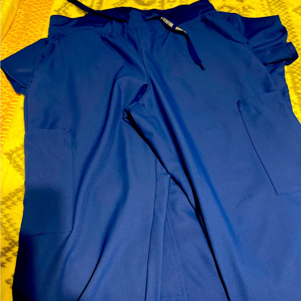 Med Couture scrubs size Medium wore once- top & bottom set. New condition